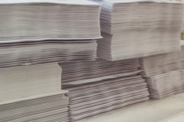 Sheets of white paper piled up for printing.