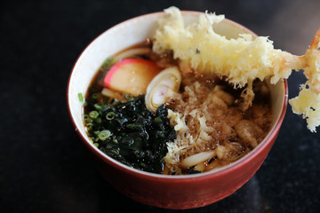 Udon noodles with fried shrimp tempura Japanese food