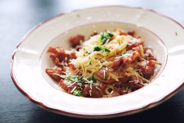Spaghetti white sauce (Spaghetti Carbonara) with bacon and garlic , on wood table background