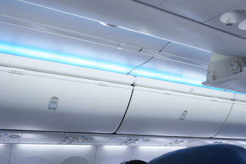 Airplane cabine with luggage compartments,luggage ready for departure on board aircraft