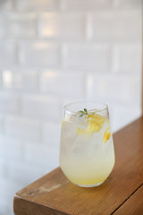 Lemonade or mojito cocktail with lemon and mint, cold refreshing drink or beverage with ice
