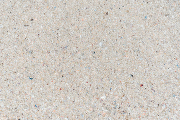 The view from the top. Summer beach, sea background of sand and clear water with foam on the ocean. The concept of vacation, vacation, travel services, background for the subject flat lay. Copy space