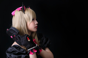 Japan anime cosplay , portrait of girl cosplay isolated in black background - obrazy, fototapety, plakaty