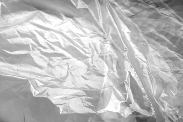 Plastic transparent old wrap texture in black and white.
