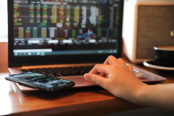 Fototapeta premium Woman hand working at coffee shop hand on keyboard with close up