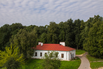 Old buildings of the late 19th century among trees in Veliky Novgorod