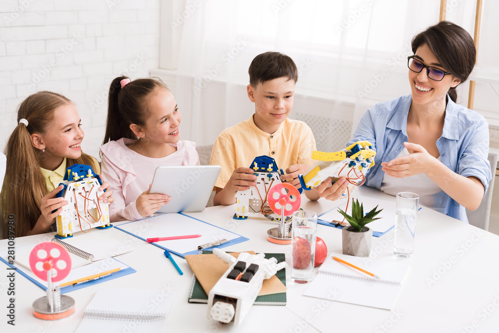 Poster stem education. children creating robots with teacher