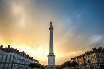Fototapeta na wymiar France, Loire Atlantique, Nantes, place Marechal Foch, statue of Louis XVI on a column at Sunset