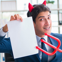 Devil angry businessman in the office