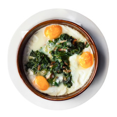 Fried eggs with spinach, raisins and ham, dish of Catalan cuisine