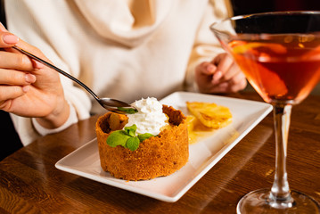 woman eating dessert with pineapple