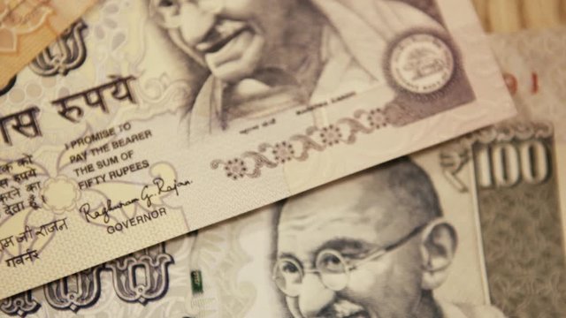 Valuable indian currency notes of 10, 50 and 100, close up macro