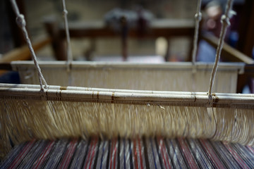 Chinese ancient looms are wrapped with cotton thread