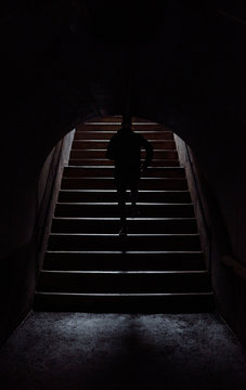 Man Running Out Of Tunnel