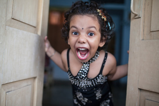 Little girl screaming and making fun
