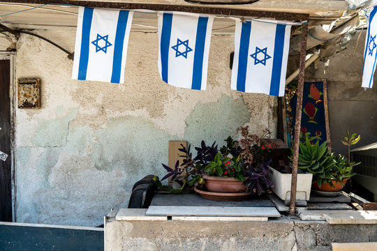 Israeli flags hanging outside of Jewish homes in Tel Aviv, Israel.