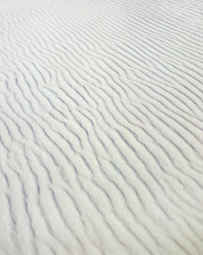 Ripples on white sand