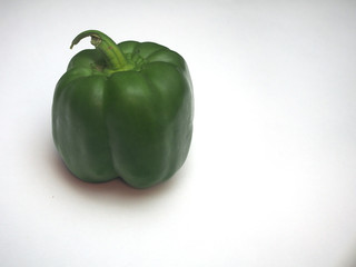 Large green fruit of sweet pepper. Photo on a white background.