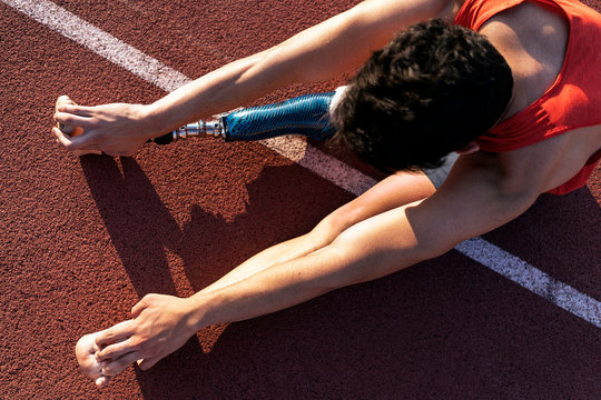 Close up disabled man athlete with leg prosthesis