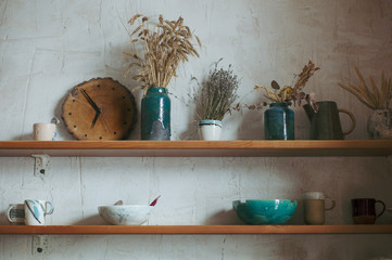 Shelves with dishes made of clay handmade