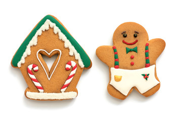 Gingerbread house and man on a white background. Christmas baking, top view, flat lay.