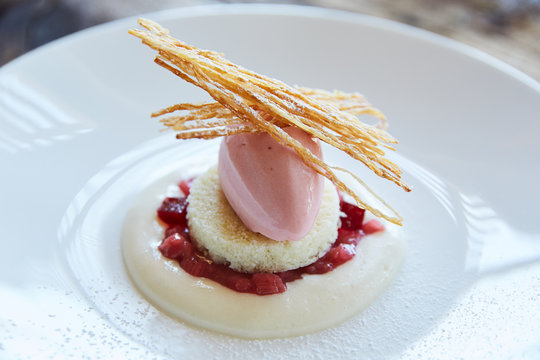Gourmet dessert with rhubarb and cake
