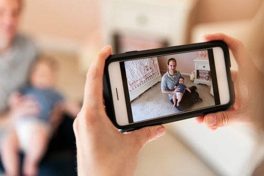 Family: Parent Taking Photo With Cell Phone