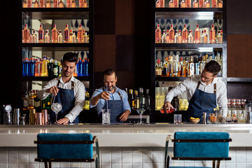 Bartenders working in bar