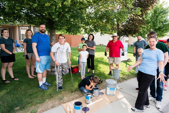 Volunteers Painting a House