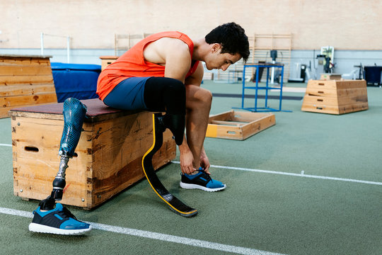 Disabled man athlete ready for training with leg prosthesis