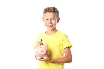 Fototapeta na wymiar Boy in yellow t-shirt with piggy bank isolated on white background