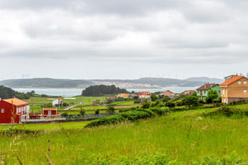 Overcast summer Cantabrian Sea coastline view with Merexo and Camarinas in the background on the Way of St. James, Camino de Santiago, Province of A Coruna, Galicia, Spain