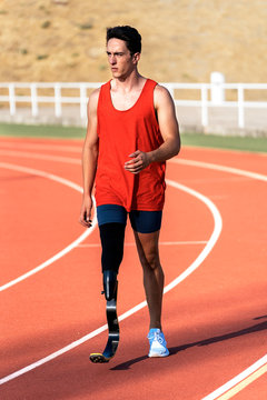 Portrait of disabled man athlete with leg prosthesis.