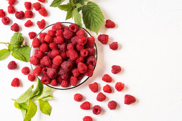 Red fresh ripe raspberry in a bowl. Summer concept.