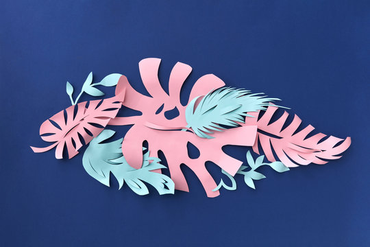 Colorful handcraft design cut from colored paper on a dark blue