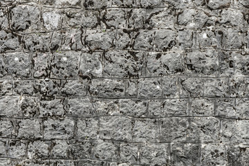Rough granite Brick wall background. Background texture of stone wall.