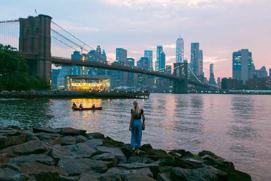 Girl walking the shore of the Hudson River