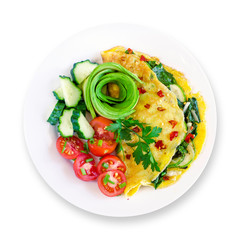Healthy delicious keto paleo breakfast on white plate: veggie omelette with fresh vegetables and avocado flower. White background. Top view.