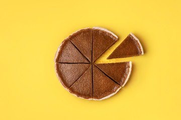 Pumpkin pie cut in slices and one separated - obrazy, fototapety, plakaty