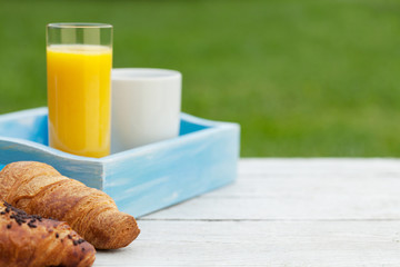 Coffee, orange juice and croissant