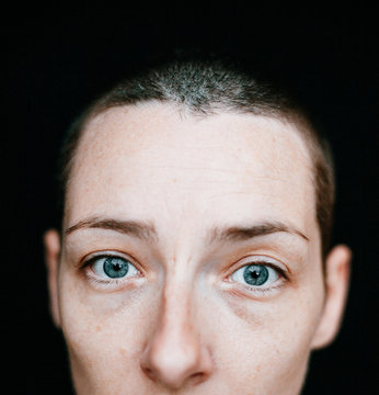 portrait of a woman with blue eyes and short hair