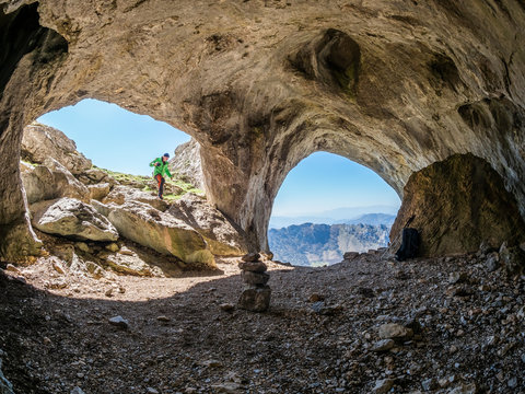 Spain, Asturia, Pena Mea, hiker in a cave