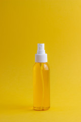 Cosmetics on a yellow background. Minimalism. Skincare.