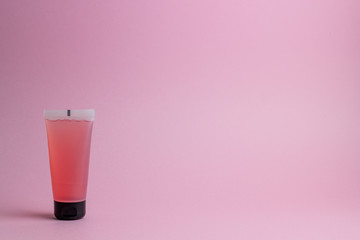 Cosmetics on a pink background. Minimalism. Skincare.
