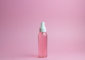Cosmetics on a pink background. Minimalism. Skincare.