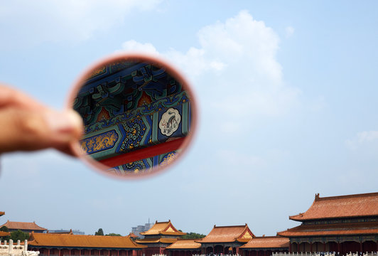 The details of the Forbidden City building are seen in the mirror. Forbidden City, Beijing, China.