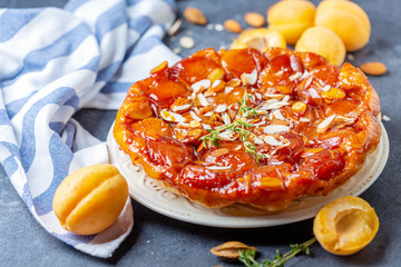 Apricot tarte tatin pie with thyme and almonds.