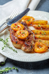 Entrecote of pork with apricots and thyme.