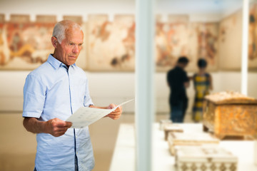 Man exploring artworks in museum