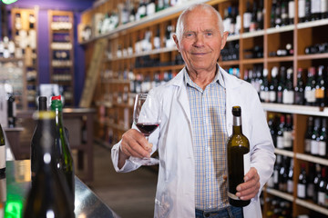 Owner of winery inviting to tasting wine
